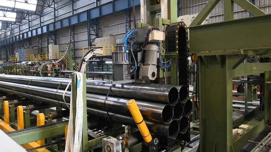 Stacked stainless steel pipes and tubes in a warehouse